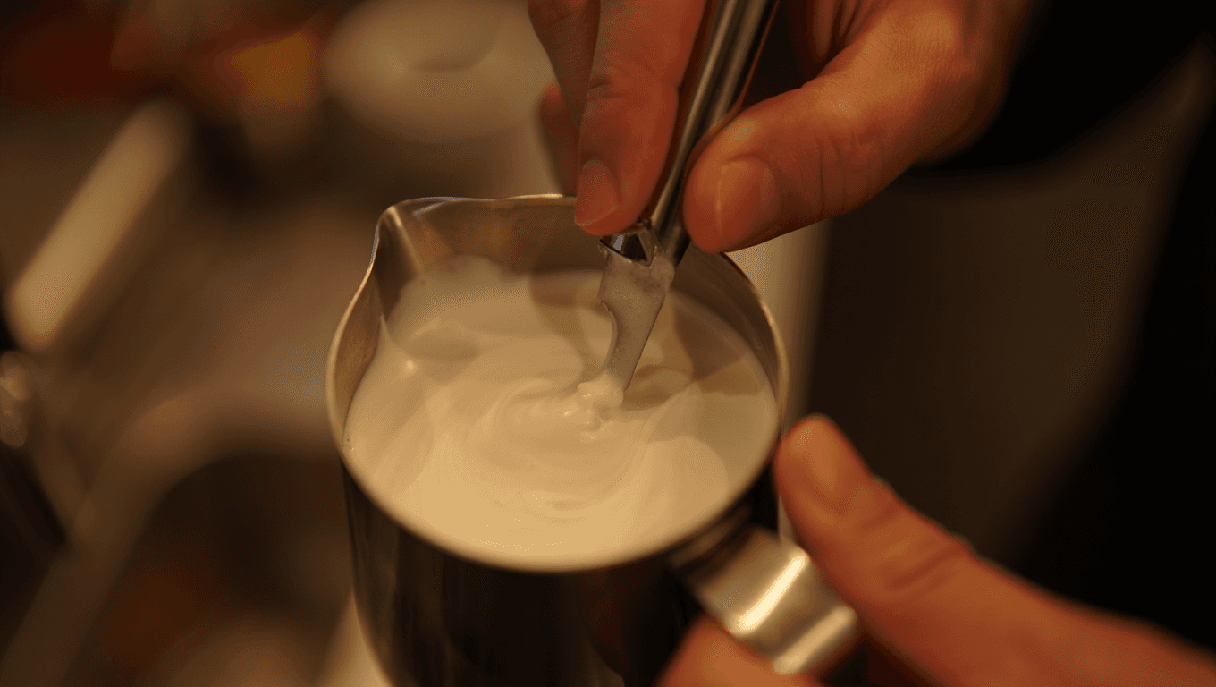 The Physics of "Steam Wand" Angles for Perfect Vortex Texturing